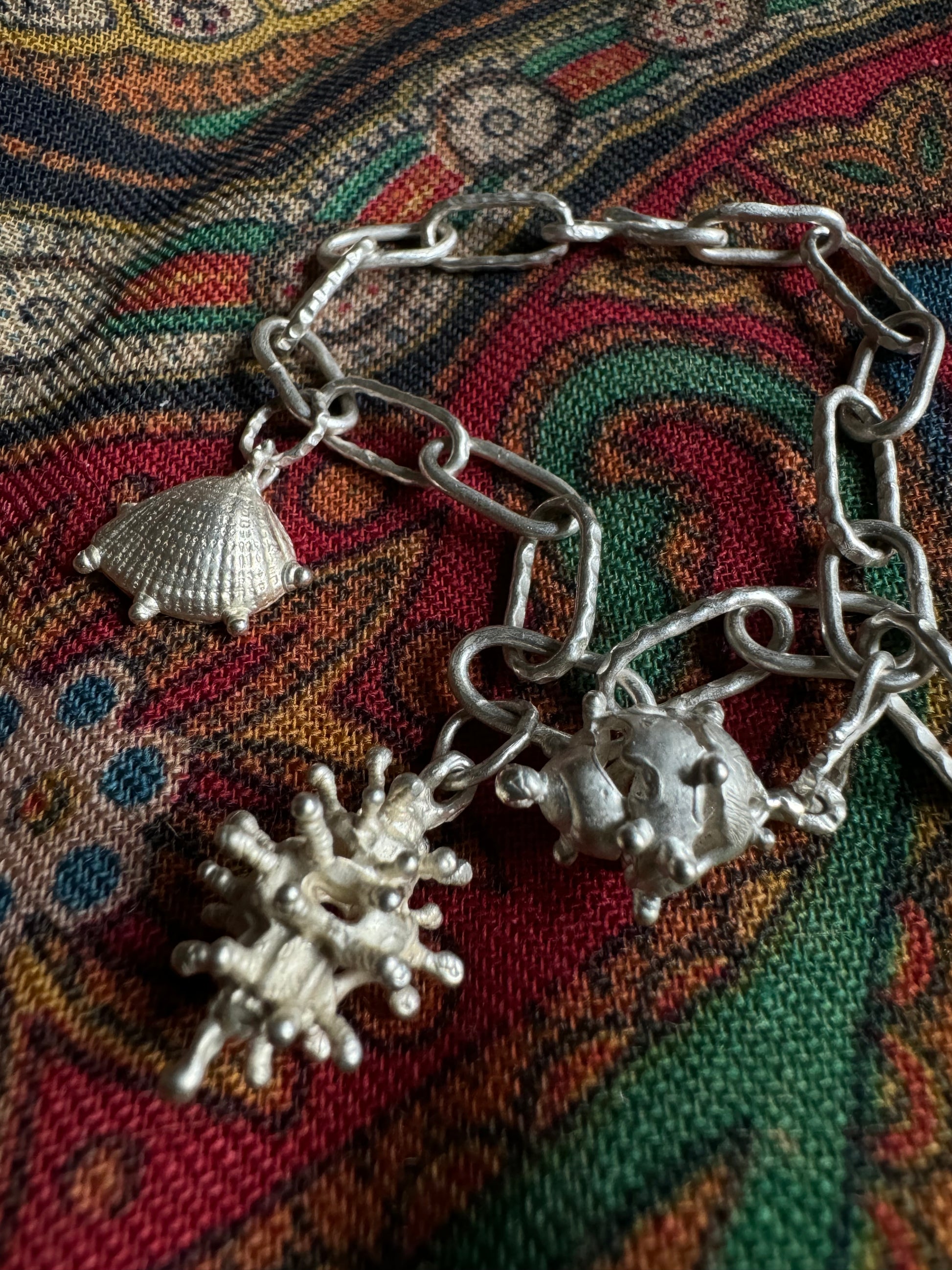 Handmade conch bracelet in sterling silver 925, crafted by Chinese artist Xiao, highlighting Eastern Culture design.