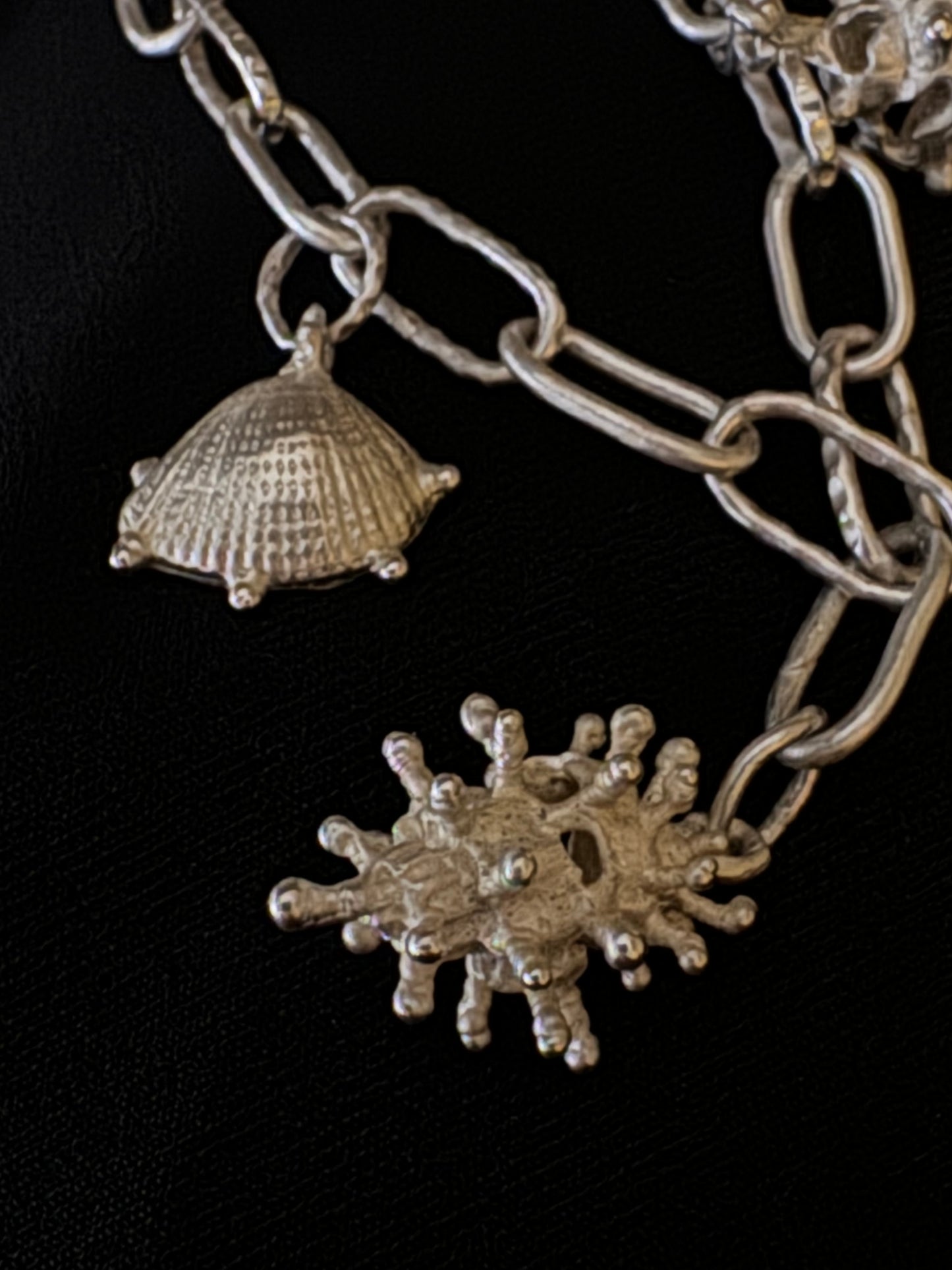 Handmade sterling silver 925 bracelet by Chinese artist Xiao, featuring conch design, representing Eastern culture.